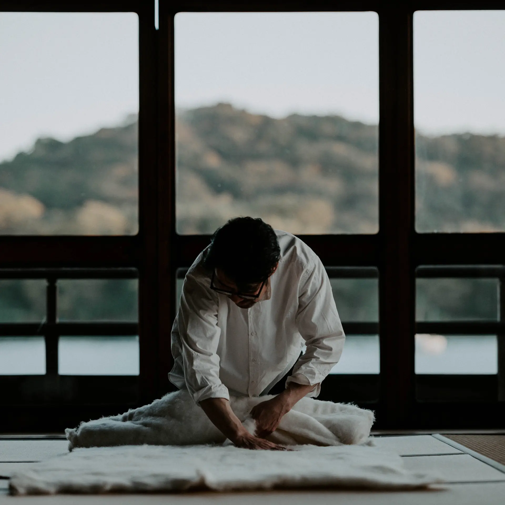 Takuya Niwa by a window