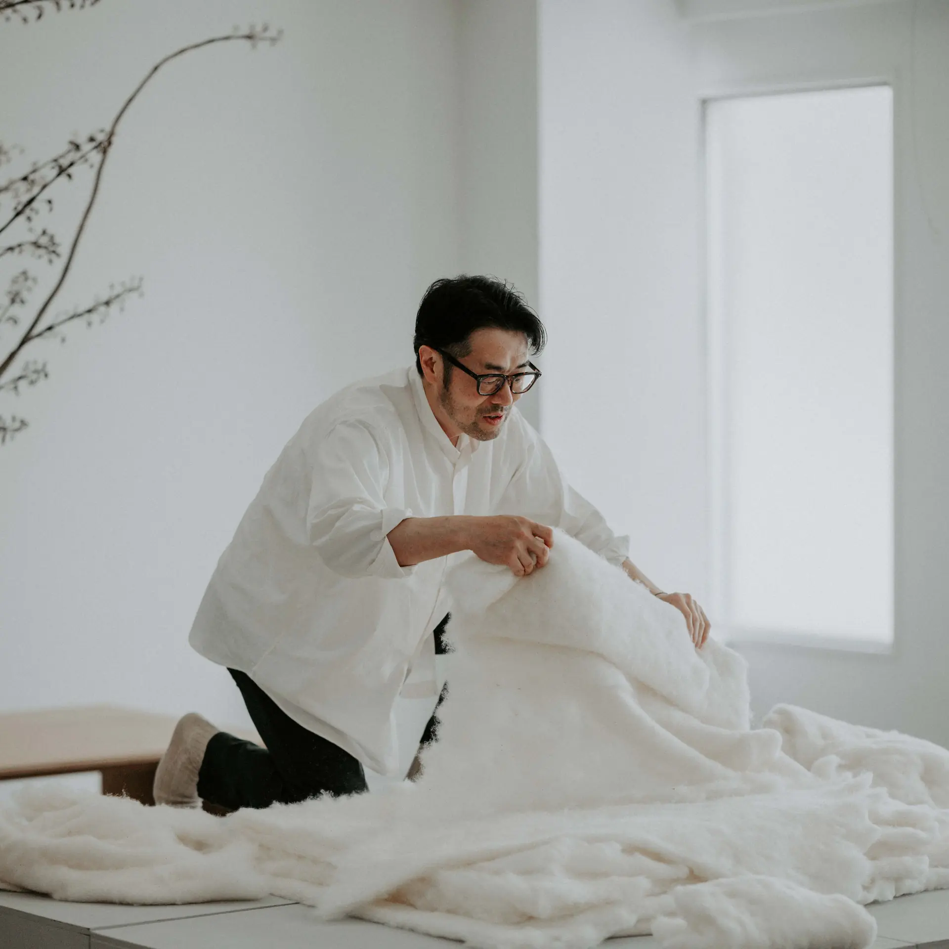 Raw cotton drawn out and layered by hand.